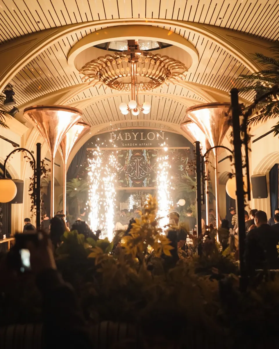 Lights and guests at a Babylon evening event